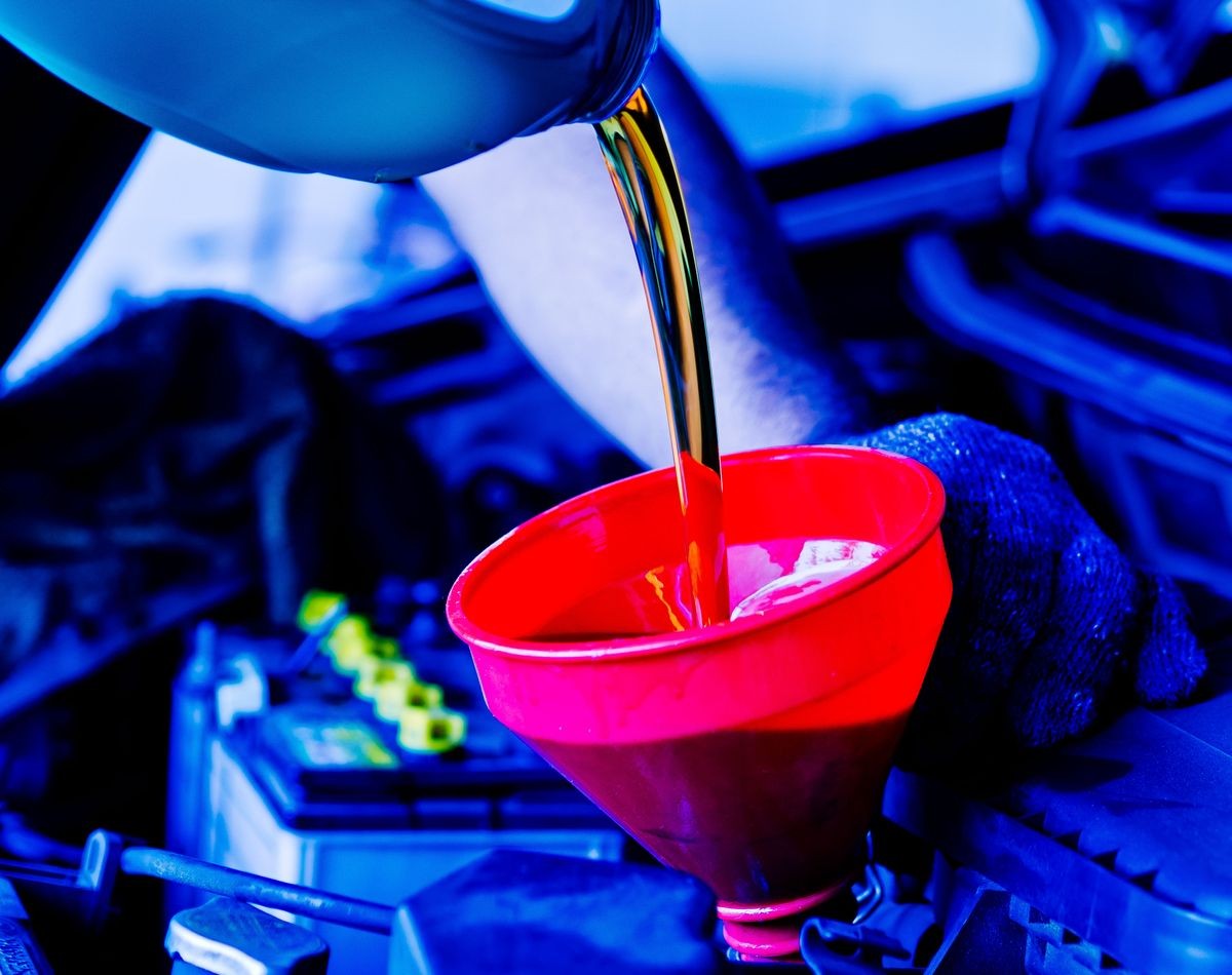 change oil car engine, filling the engine oil, new oil into car, pouring fresh oil, service car station
